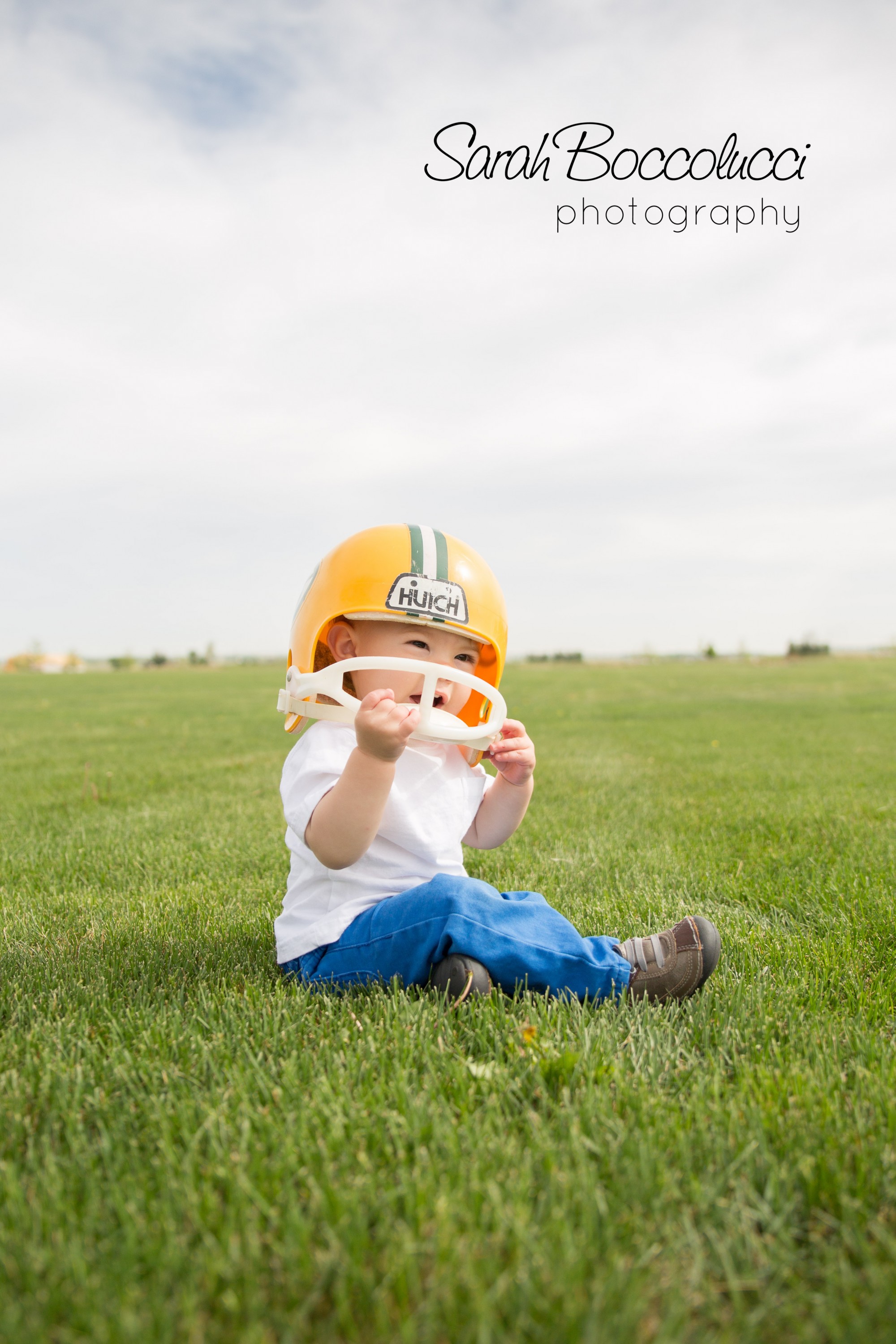 Baby in a football helmet