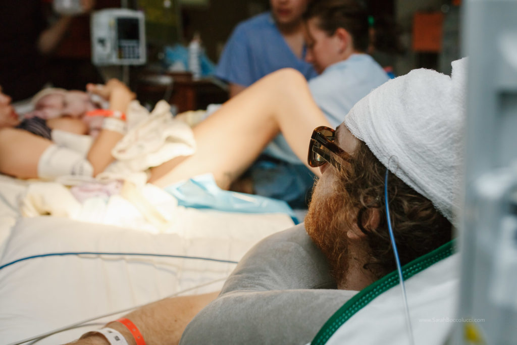 Boulder, Colorado Birth Photography, Dad looking at mom and baby