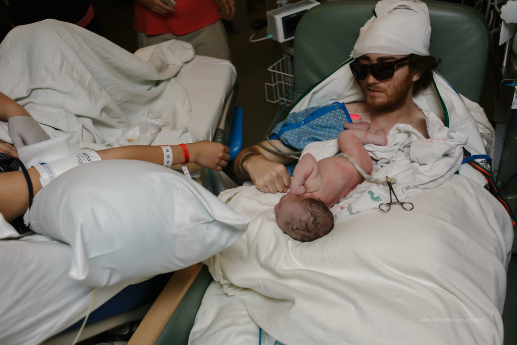 Boulder, Colorado Birth Photography, Dad with brain cancer holding baby