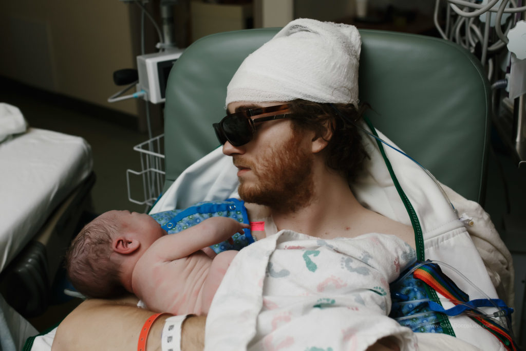 Boulder, Colorado Birth Photography, Dad with brain cancer holding baby