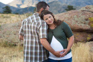 Johnston, Colorado maternity photographer, couple holding belly