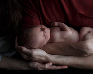 Boulder, Colorado Newborn Photographer, In home photography session, mom and dad holding baby